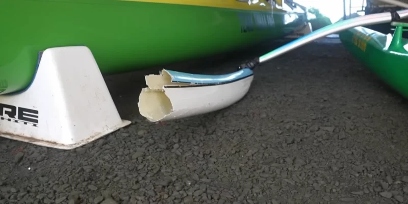 The white and light-blue outrigger of Lywaï Manate's Va'a damaged during a shark attack