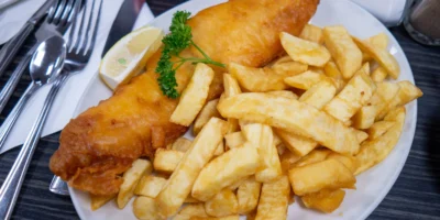 Fish and chips with lemon on a plate in Blackpool