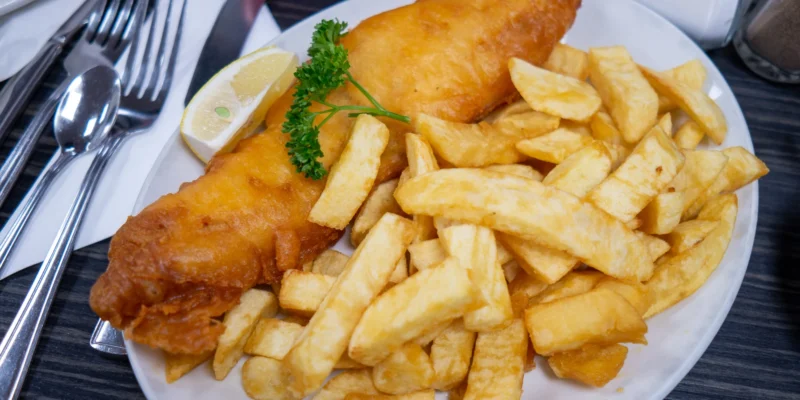 Fish and chips with lemon on a plate in Blackpool
