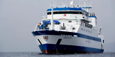 The blue and white research vessel Miguel Oliver at sea