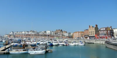 Boats in Ramsgate harbour with waterfront buildings