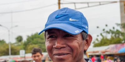 Portrait of a Wayuu man wearing a blue cap in Maracaibo, Venezuela